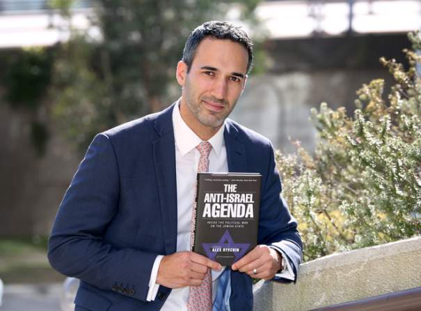 Alex Ryvchin with his new book. Picture: Noel Kessel
