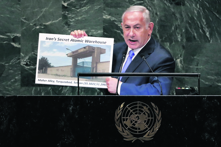 Israel's Prime Minister Benjamin Netanyahu shows an atomic warehouse in Teheran during his address the 73rd session of the United Nations General Assembly, at U.N. headquarters, Thursday, Sept. 27, 2018. (AP Photo/Richard Drew)